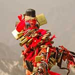 Hua Shan, Shaanxi. The padlocks and red bands symbolise devotion...