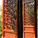 Intricate door panels in Suzhou garden