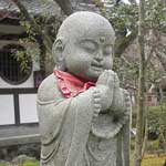 One of a pair of little praying men